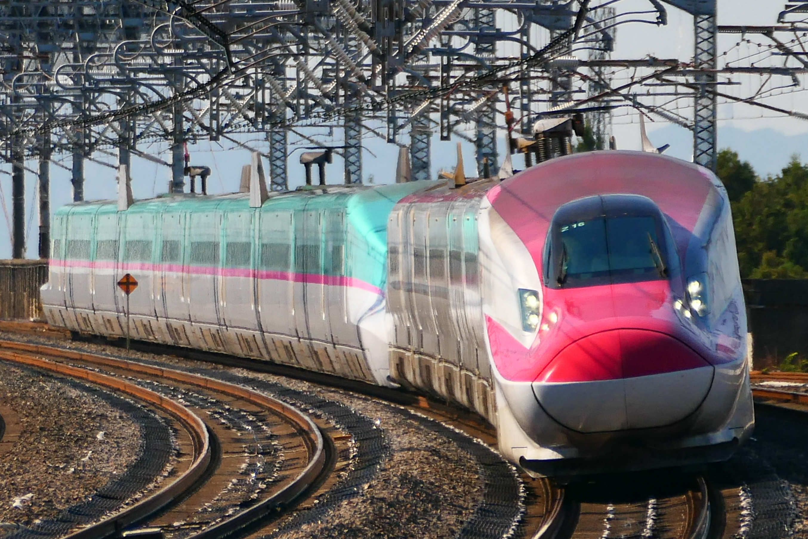 E6 Series Komachi Shinkansen in red and silver livery heading to Akita