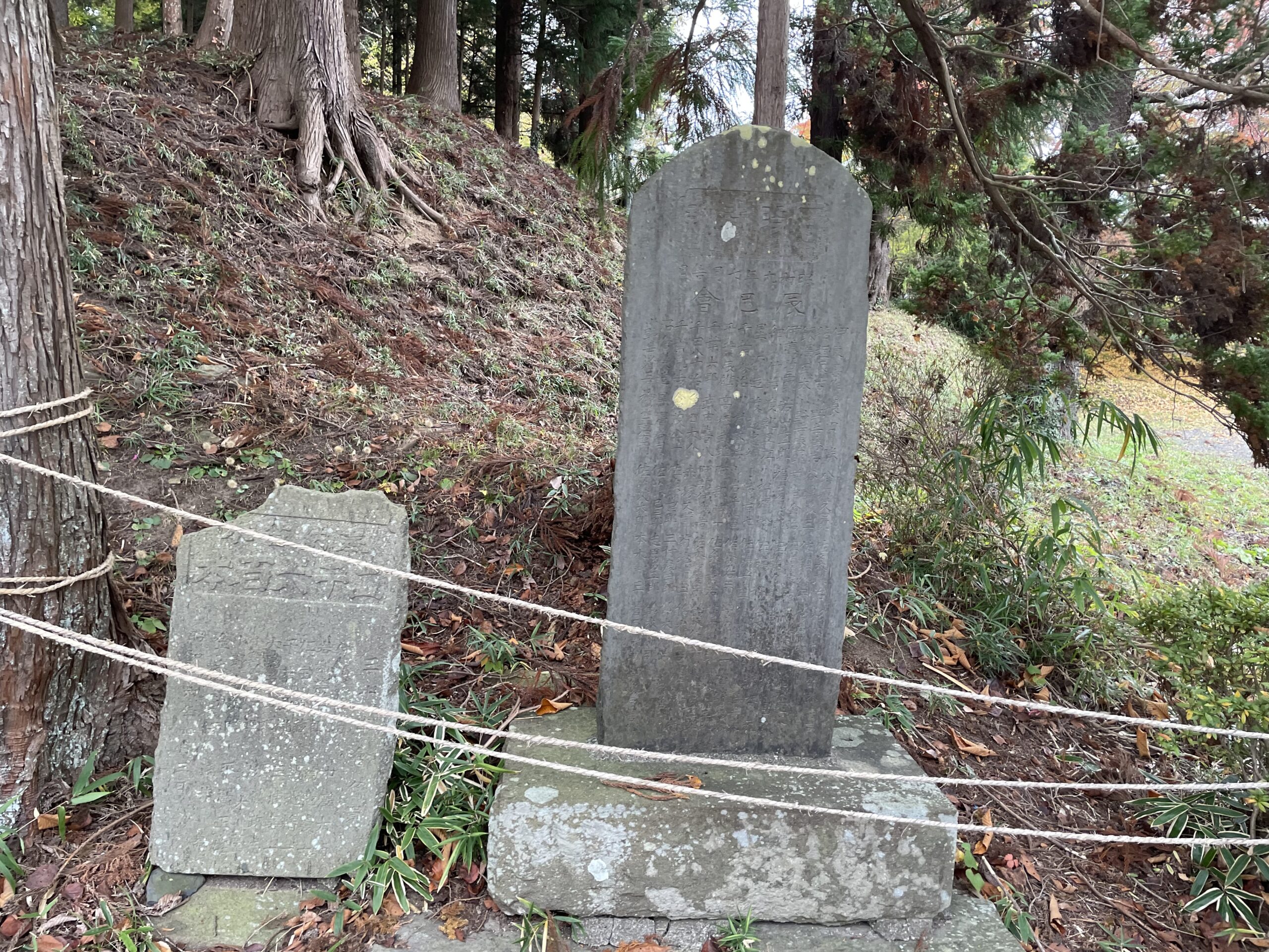 Traditional Japanese shrine garden with stone lanterns and old trees in Ichinoseki
