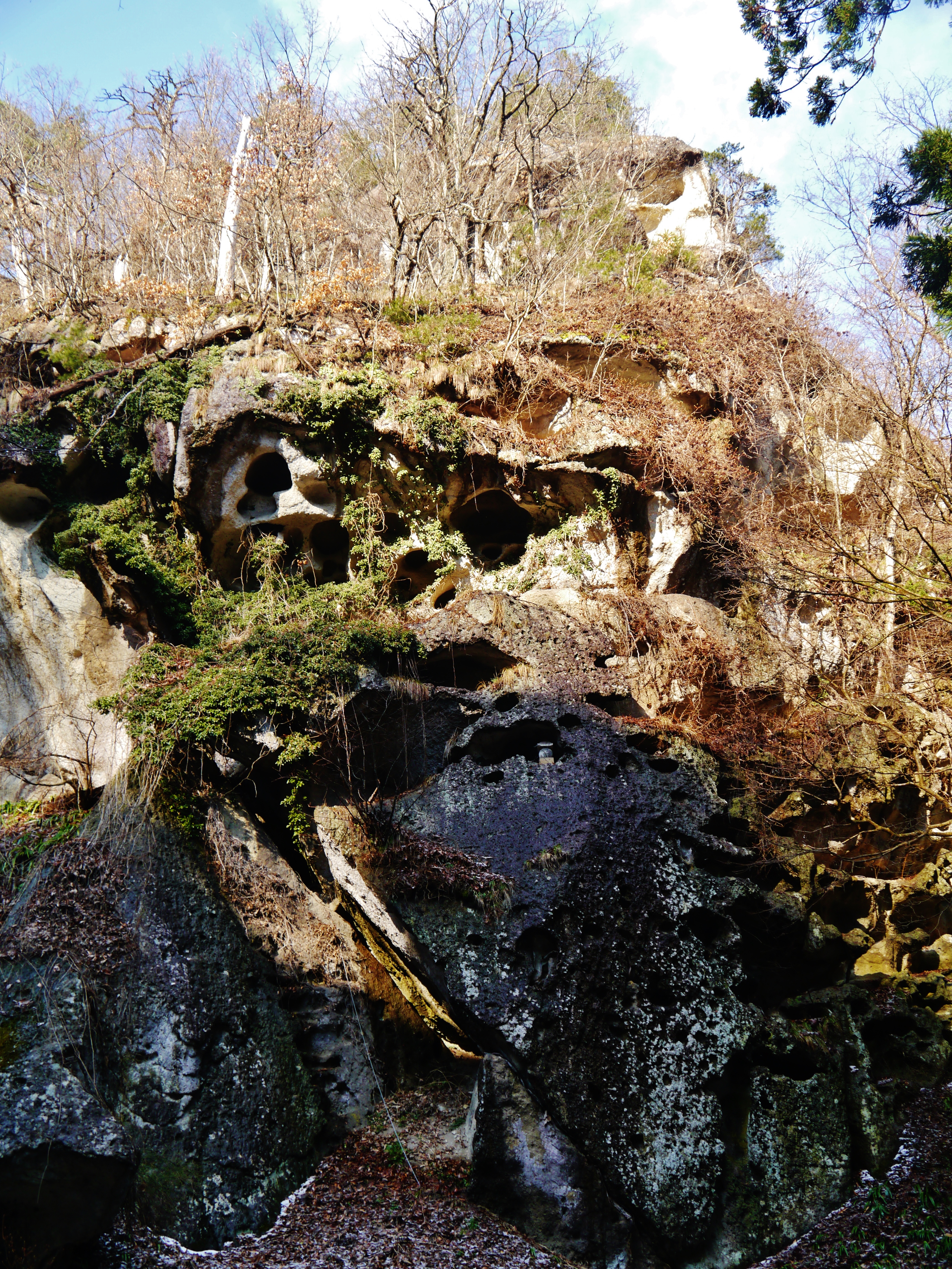 The dramatic rock cliff face of Risshakuji mountain with temple buildings visible