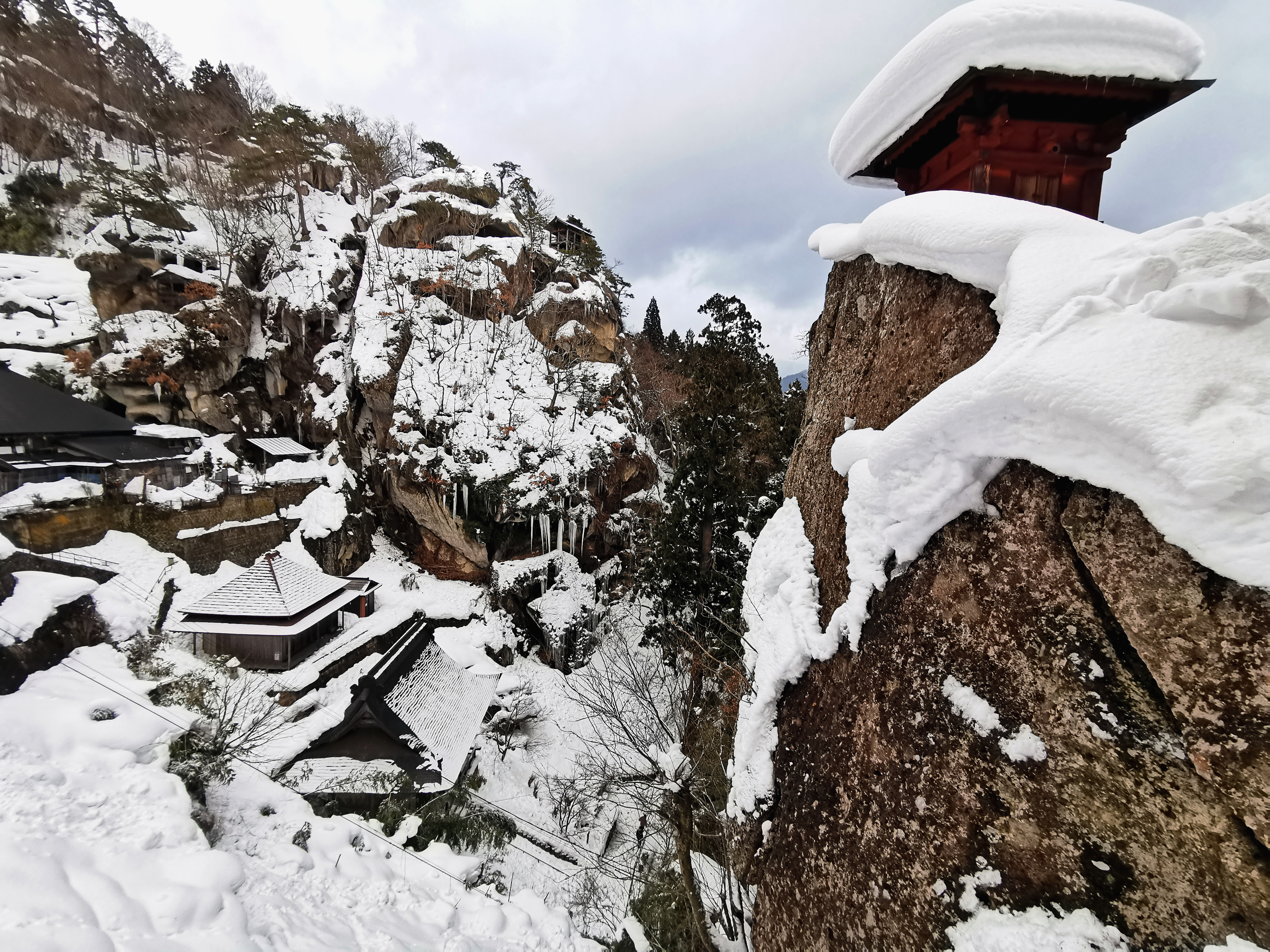 The stone staircase path (Sando) of Risshakuji Temple covered in winter snow