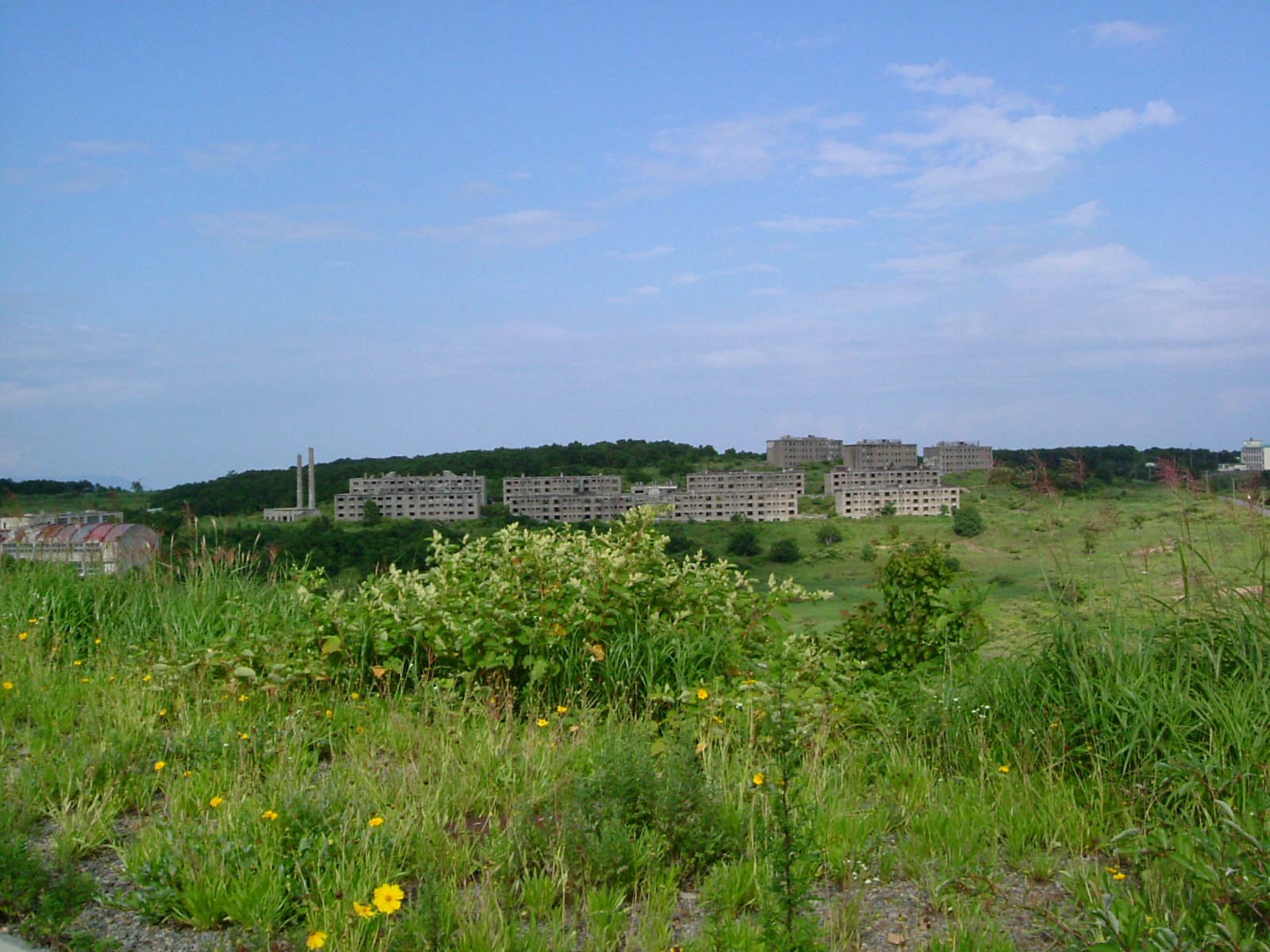 Matsuo Mine apartment building ruins surrounded by mountain mist in Iwate Prefecture