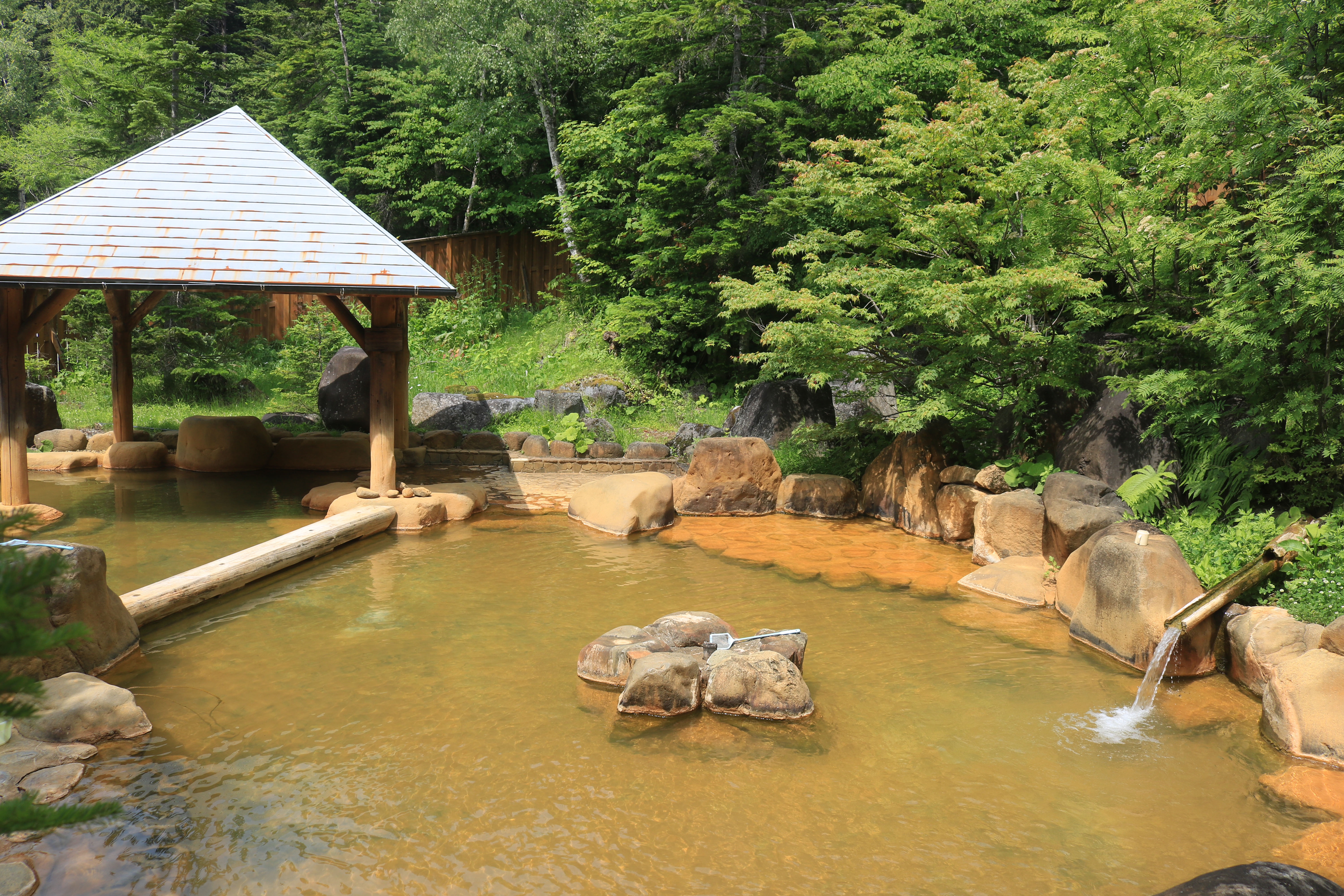 Outdoor hot spring bath in Nigorigo Onsen Japan mountain setting