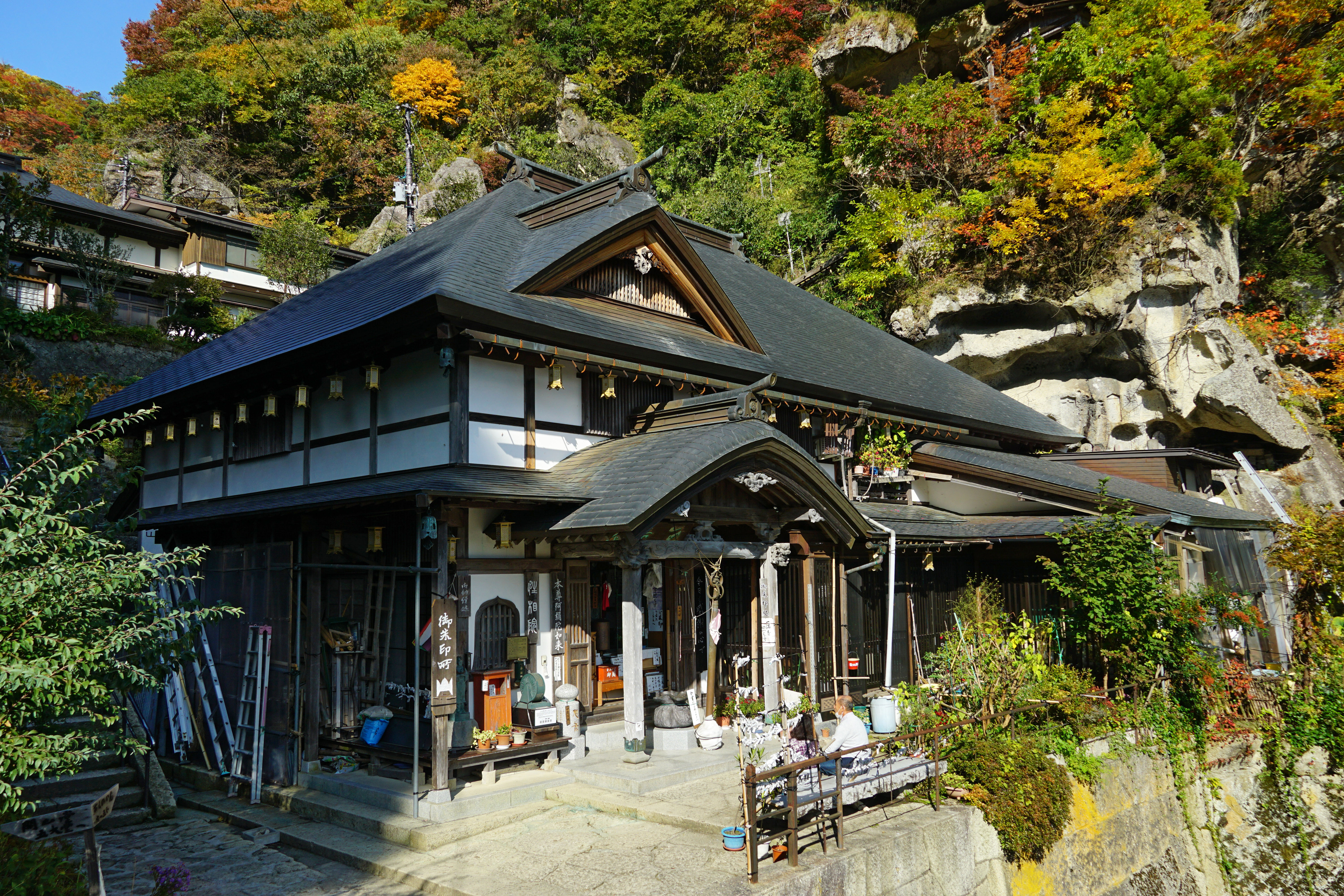 Risshakuji Temple buildings among autumn foliage in Yamagata