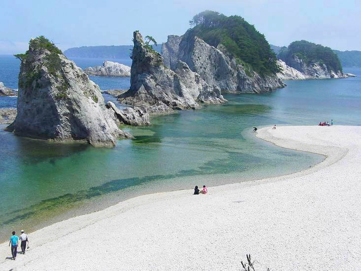 Panoramic view of Jodogahama coastline with white rocks and green pines