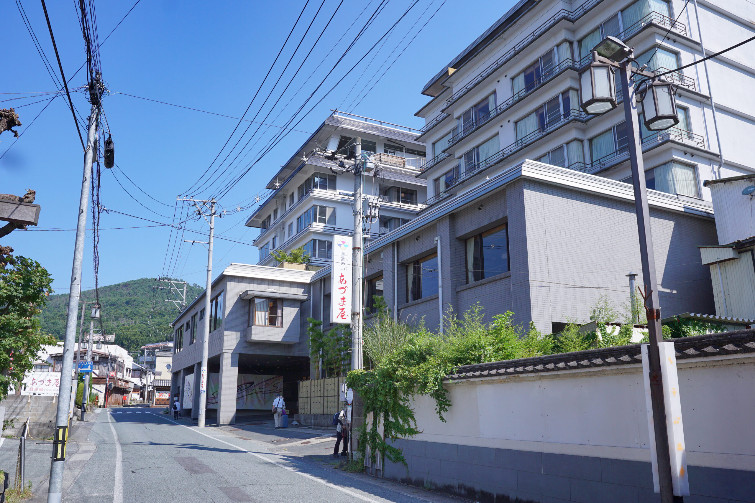 Kaminoyama Onsen town street with traditional buildings and hot spring steam