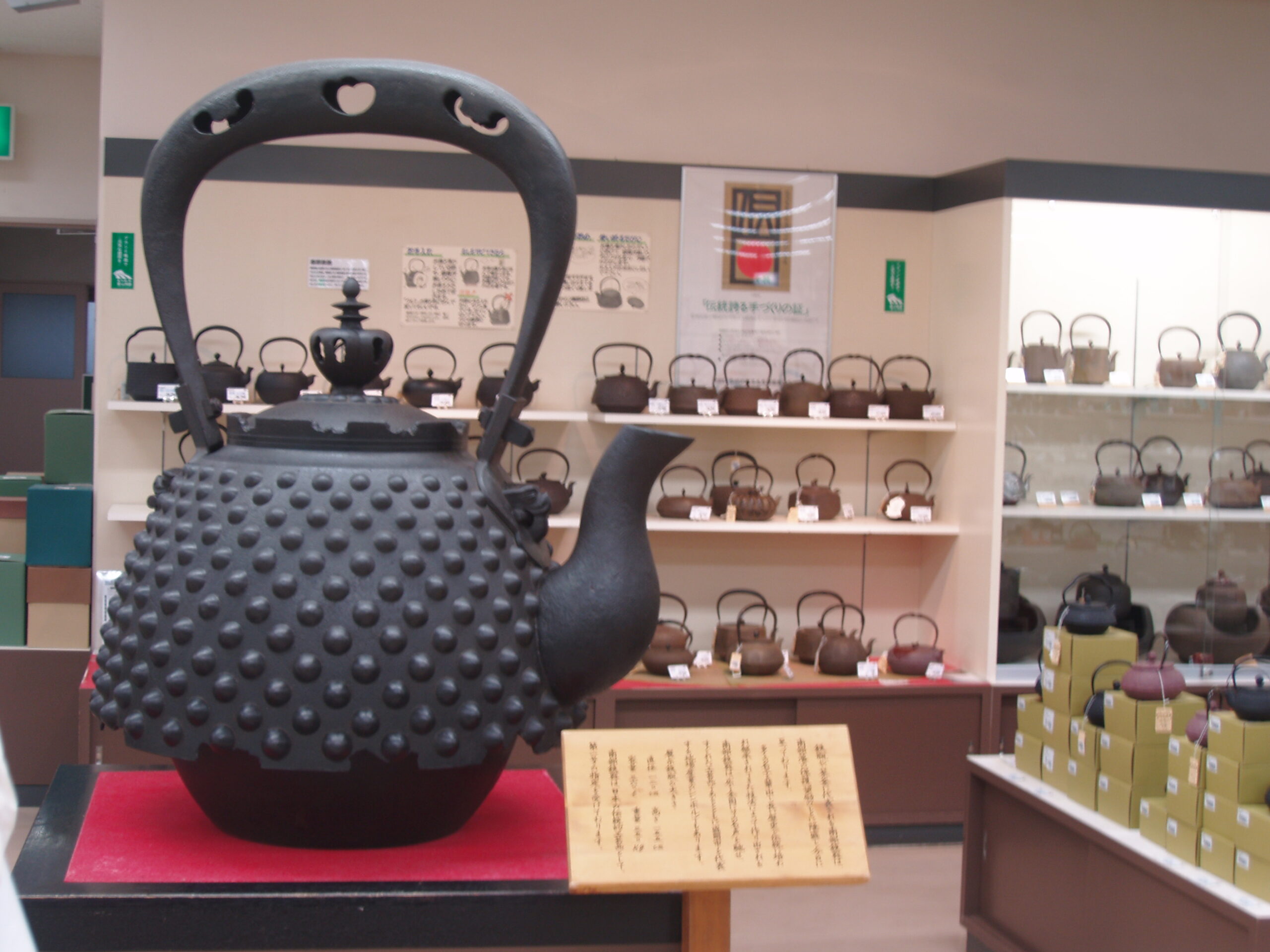 Traditional Nanbu Tekki teapots and iron kettles displayed at Morioka Handmade Village craft shop