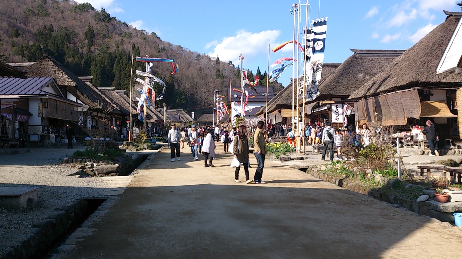 Ouchi-juku post town spring scene with thatched-roof buildings in Fukushima Japan