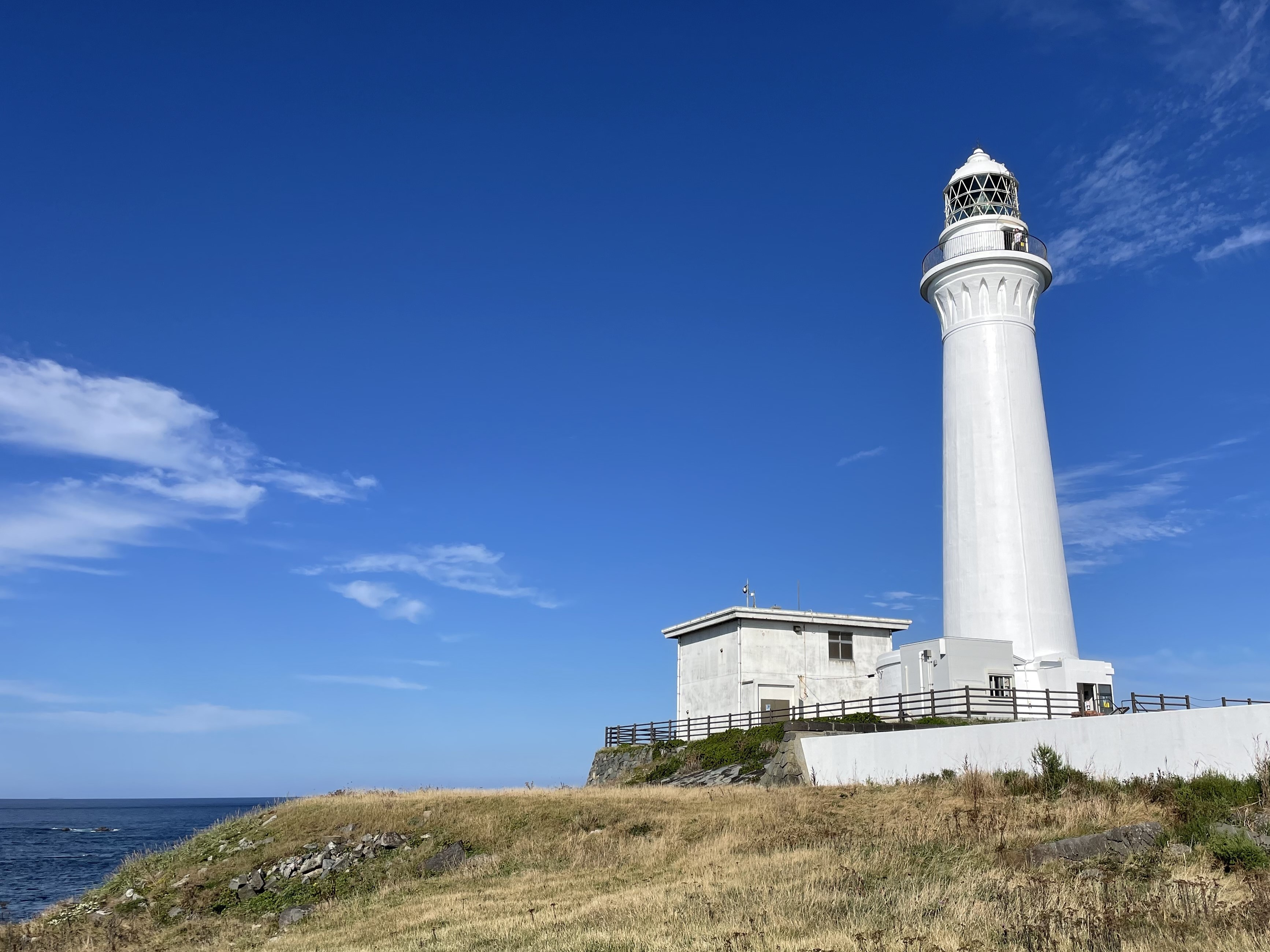 Cape Shiriyazaki lighthouse standing above the rugged Pacific coastline