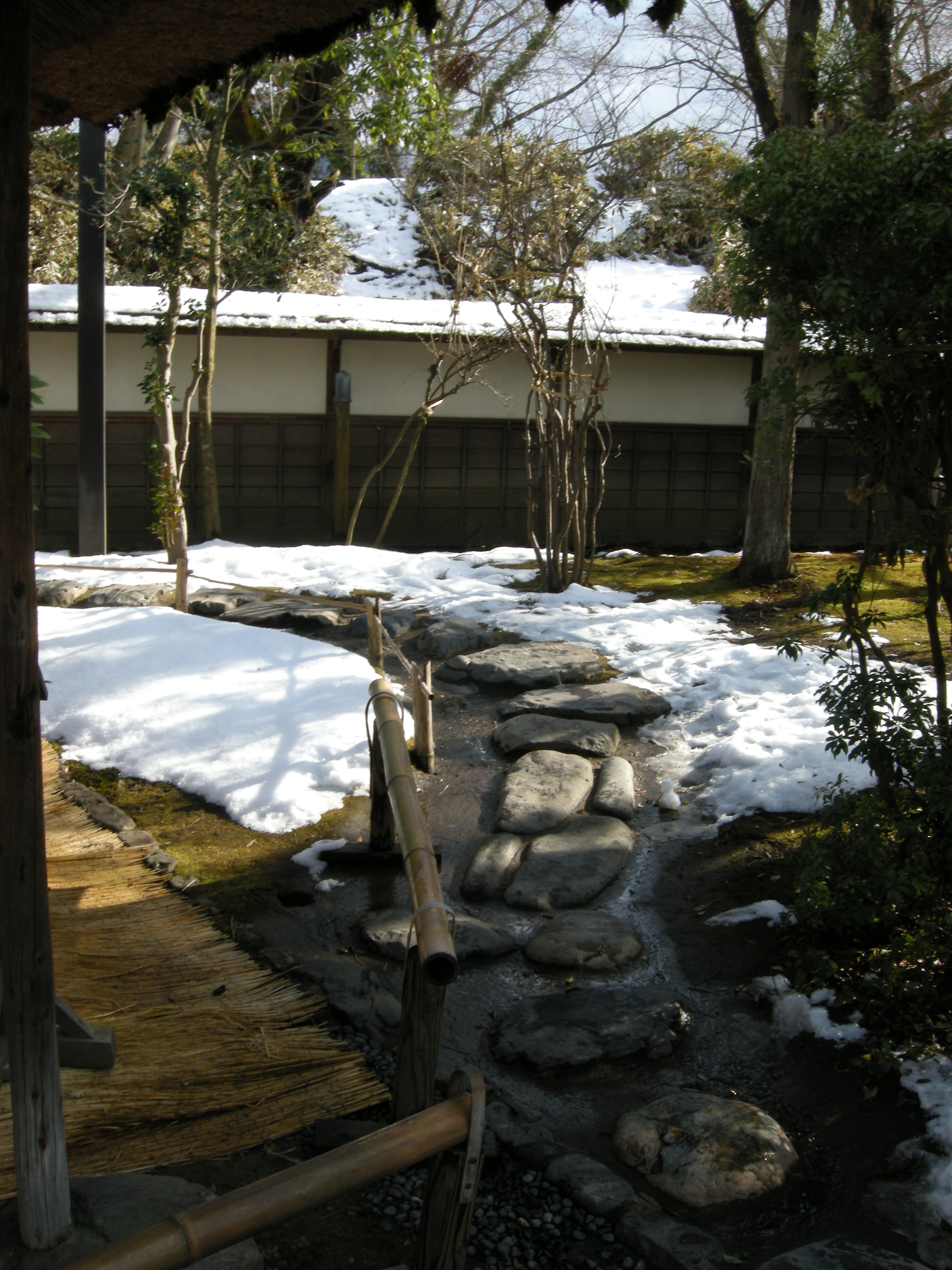 The stone-paved approach path within Aizuwakamatsu Castle grounds