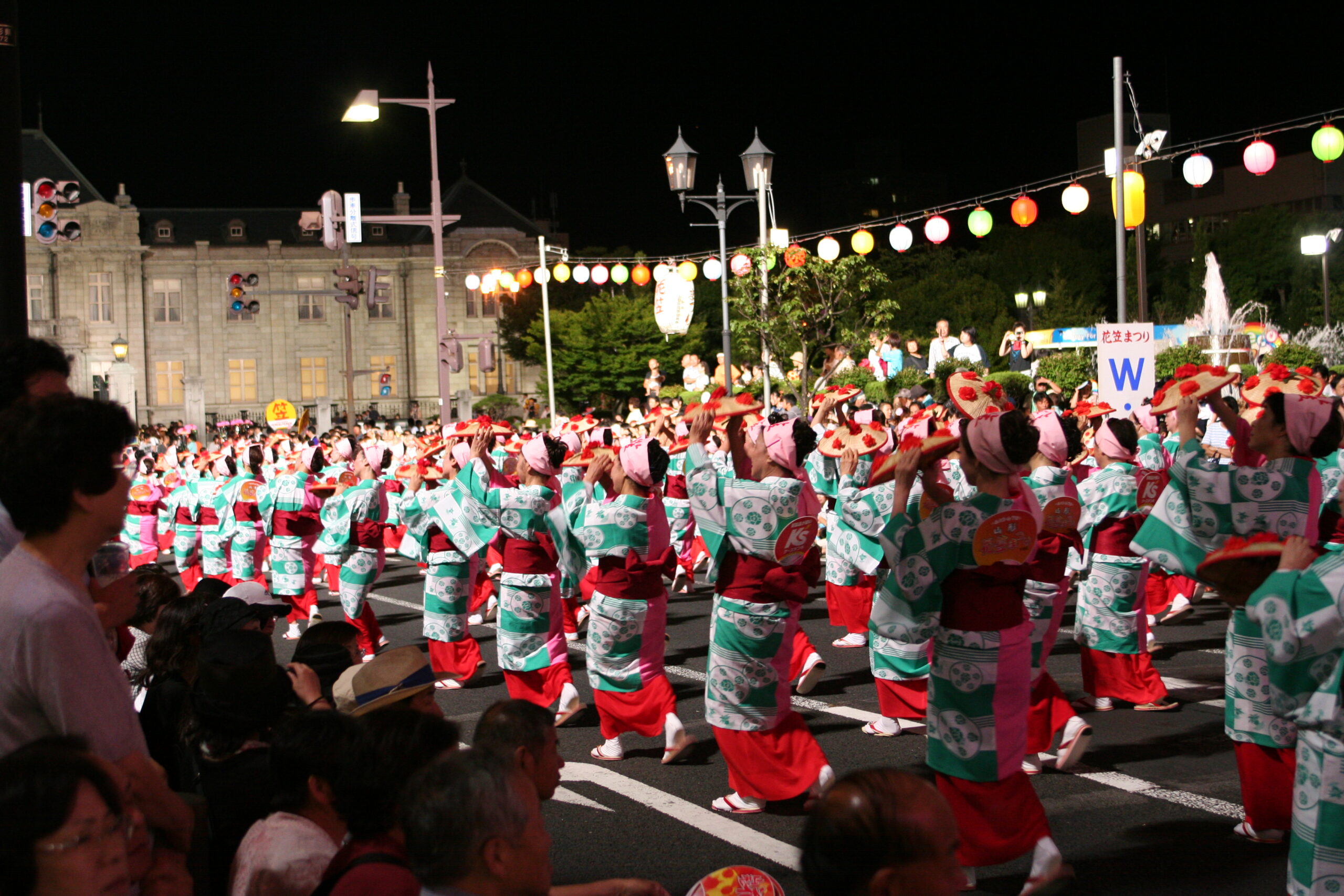 Hanagasa Matsuri 2008 dancers in traditional yukata and flower hats performing in Yamagata city streets