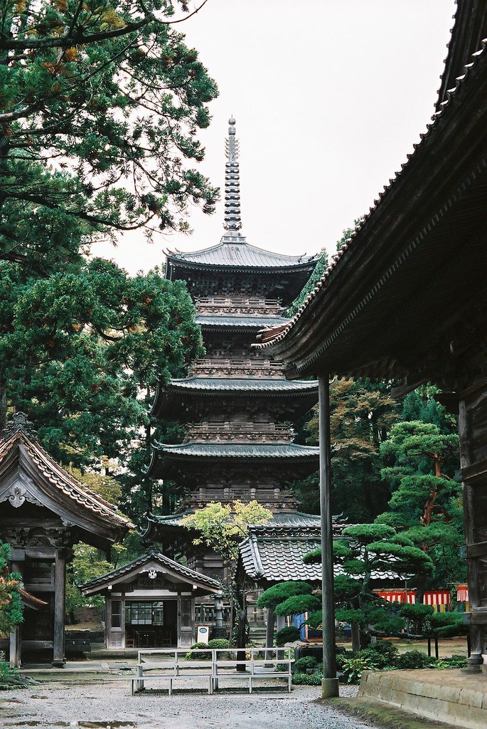 The five-story pagoda of Zenpoji Temple in Tsuruoka rising above the forested temple grounds