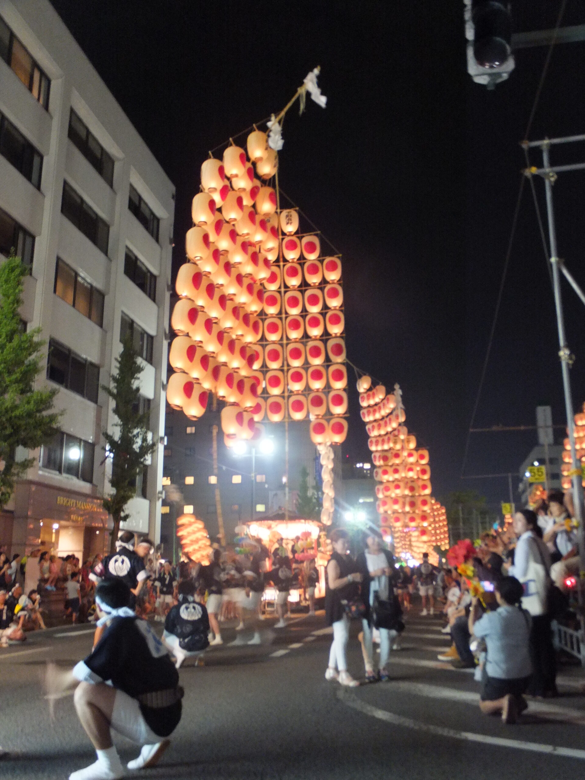 Akita Kanto Festival at night with hundreds of illuminated lanterns swaying overhead