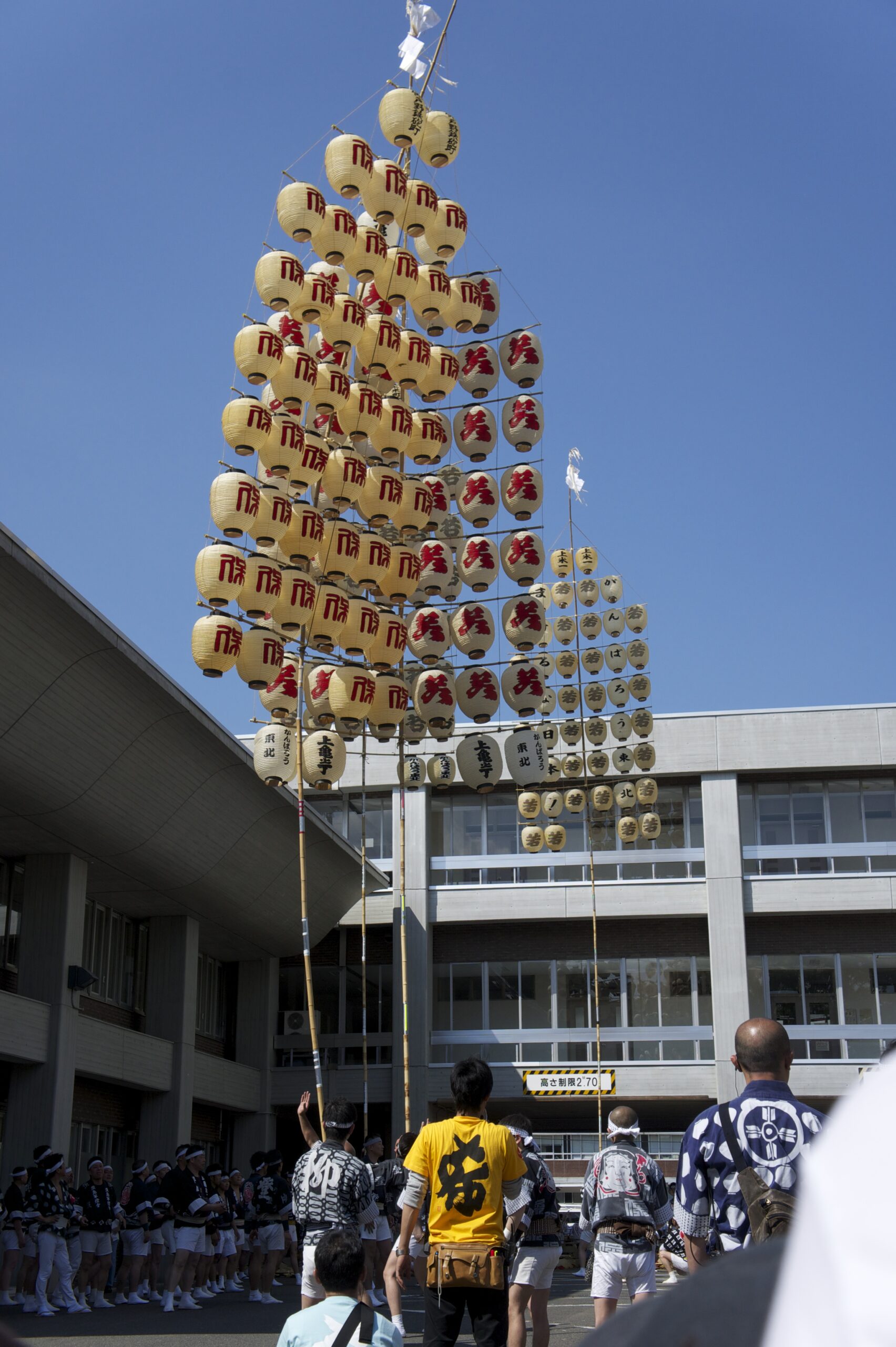 Akita Kanto performance at the Tohoku Rokkonsai Festival gathering with Nebuta floats