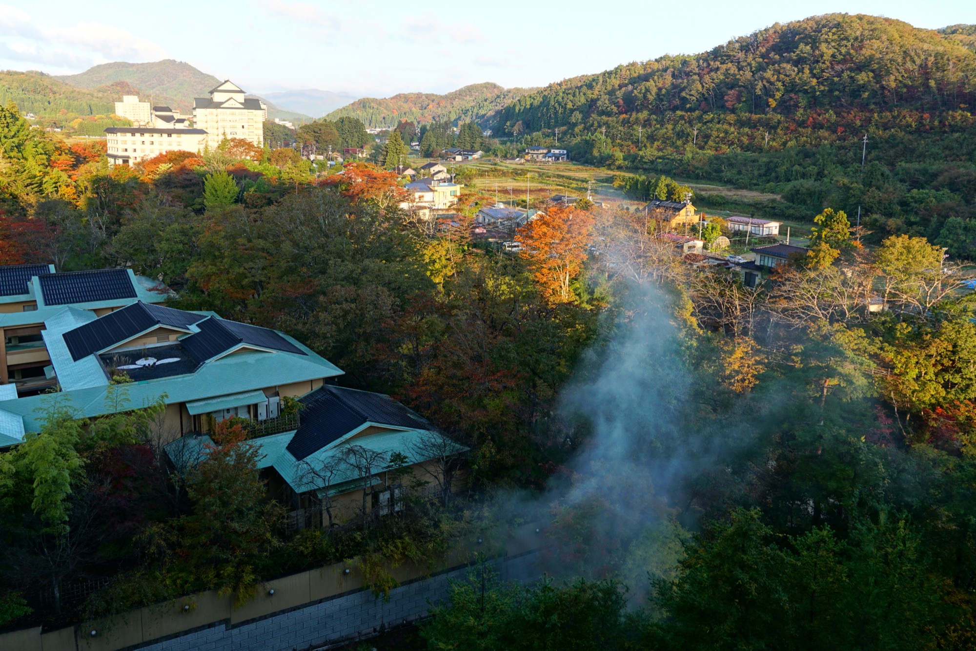 Scenic view of Akiu Onsen hot spring resort surrounded by mountains