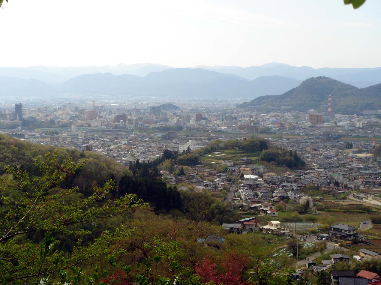 Fukushima basin panoramic view showing the city and surrounding agricultural landscape in the wide mountain-ringed valley