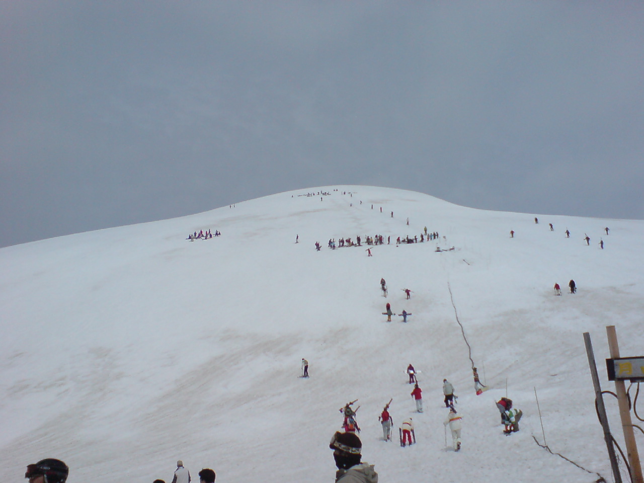 Skiers on the slopes of Gassan Ski Resort in Yamagata with deep spring snow