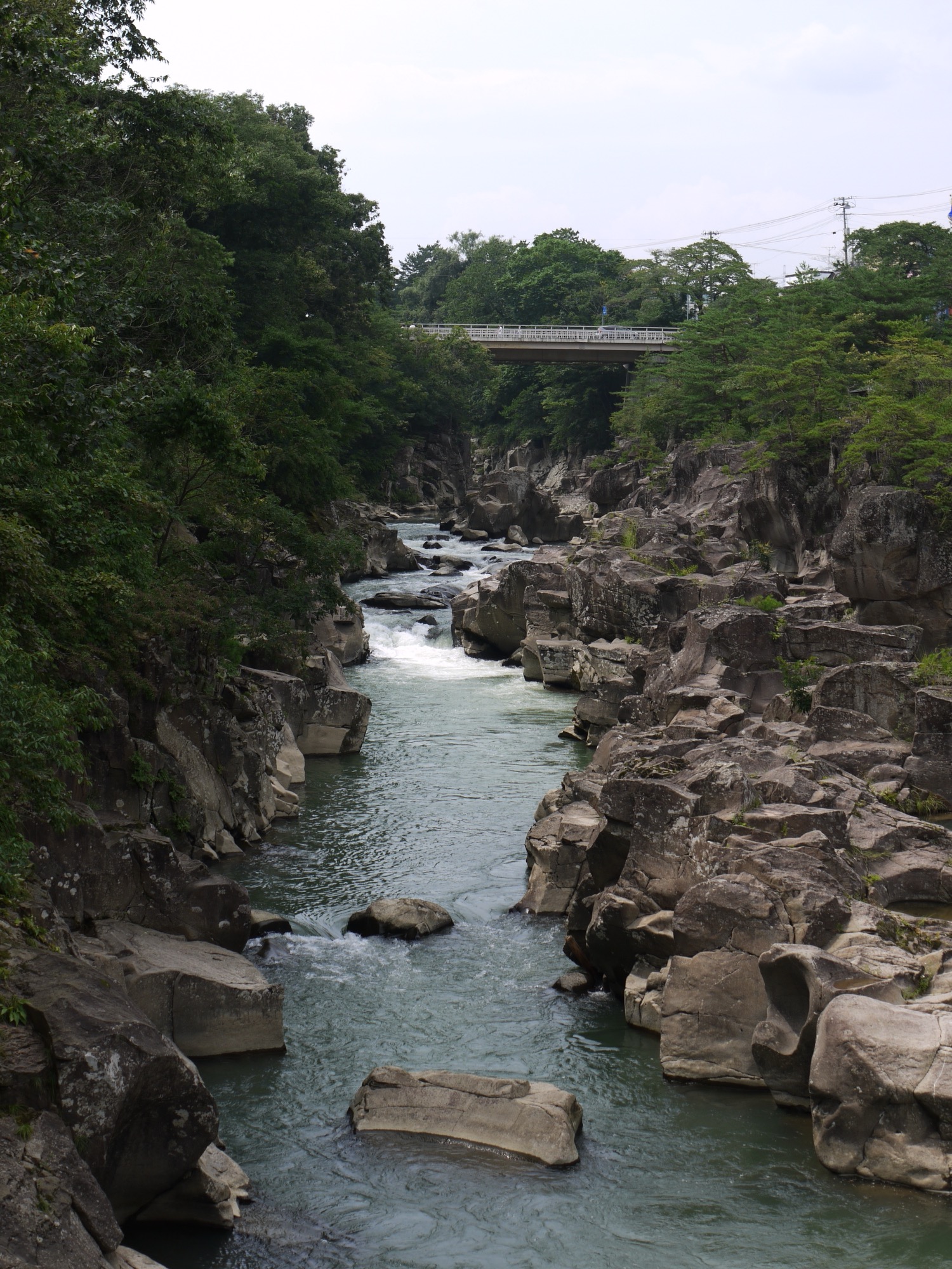 Rocky riverbed and clear water flowing through Genbikei Gorge