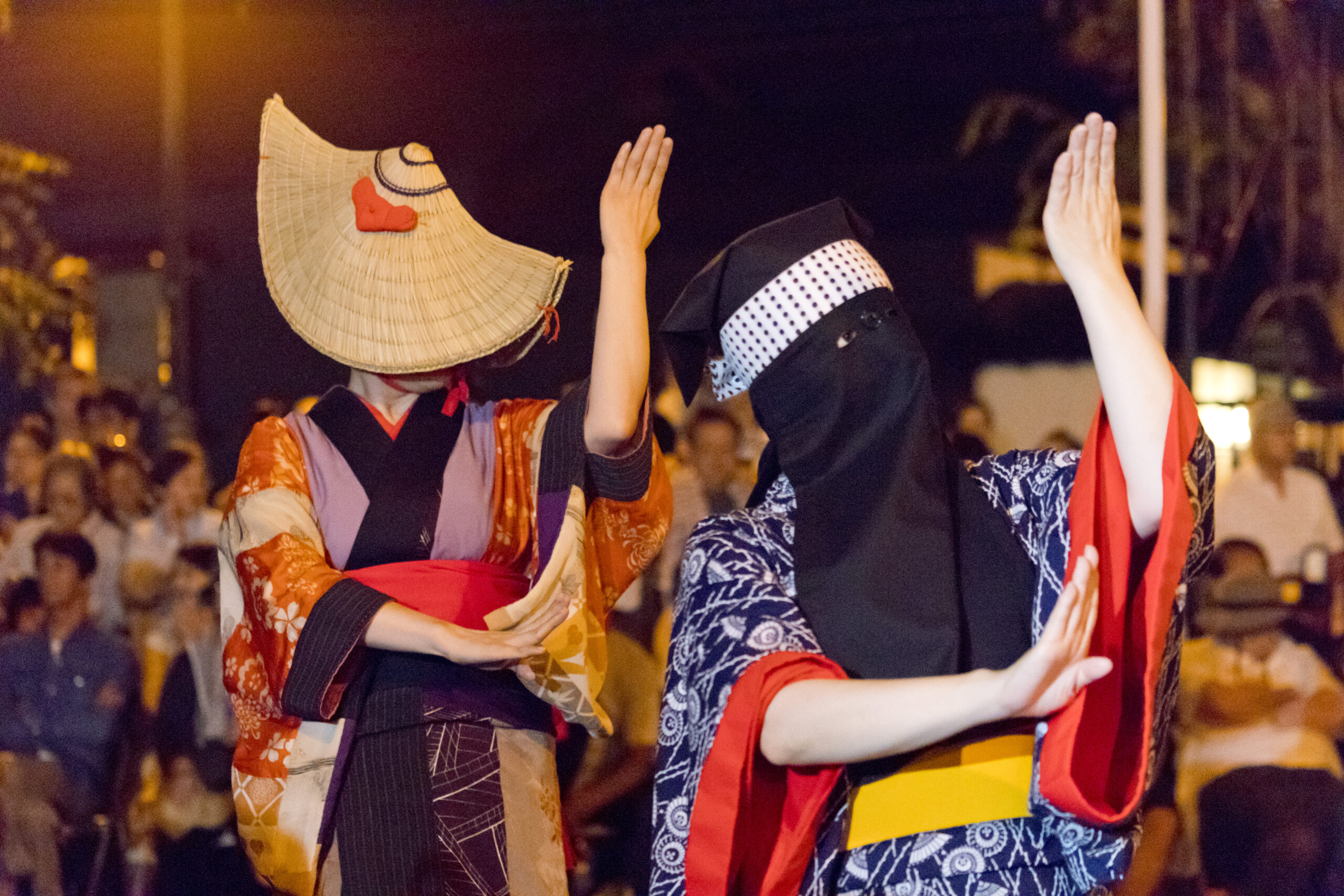Dancers at Nishimonai Bon Odori festival in Ugo Town, Akita, wearing traditional costumes with hidden faces