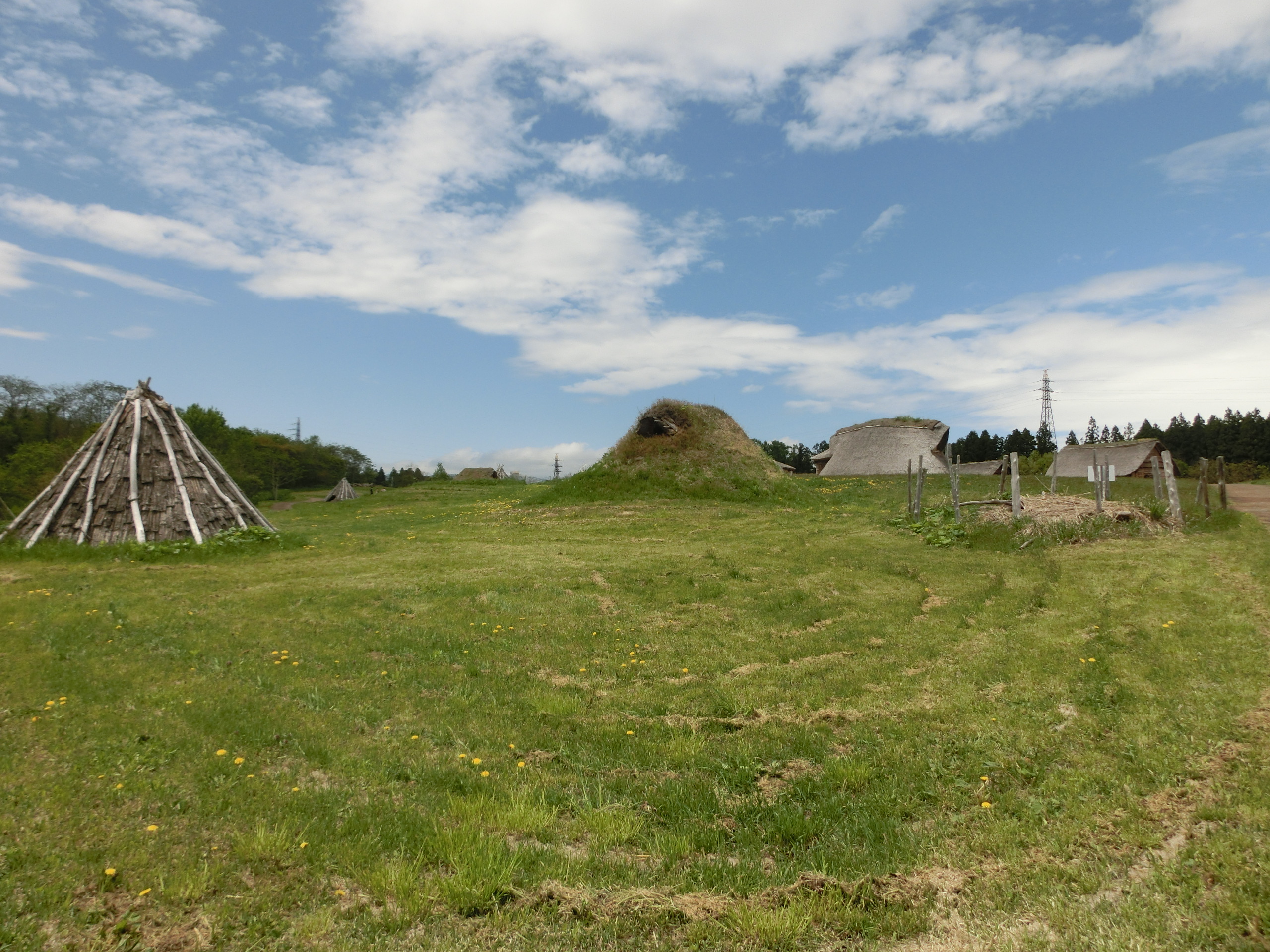 Reconstructed Jomon pit dwellings at Sannai-Maruyama showing the earthen floor sunken design