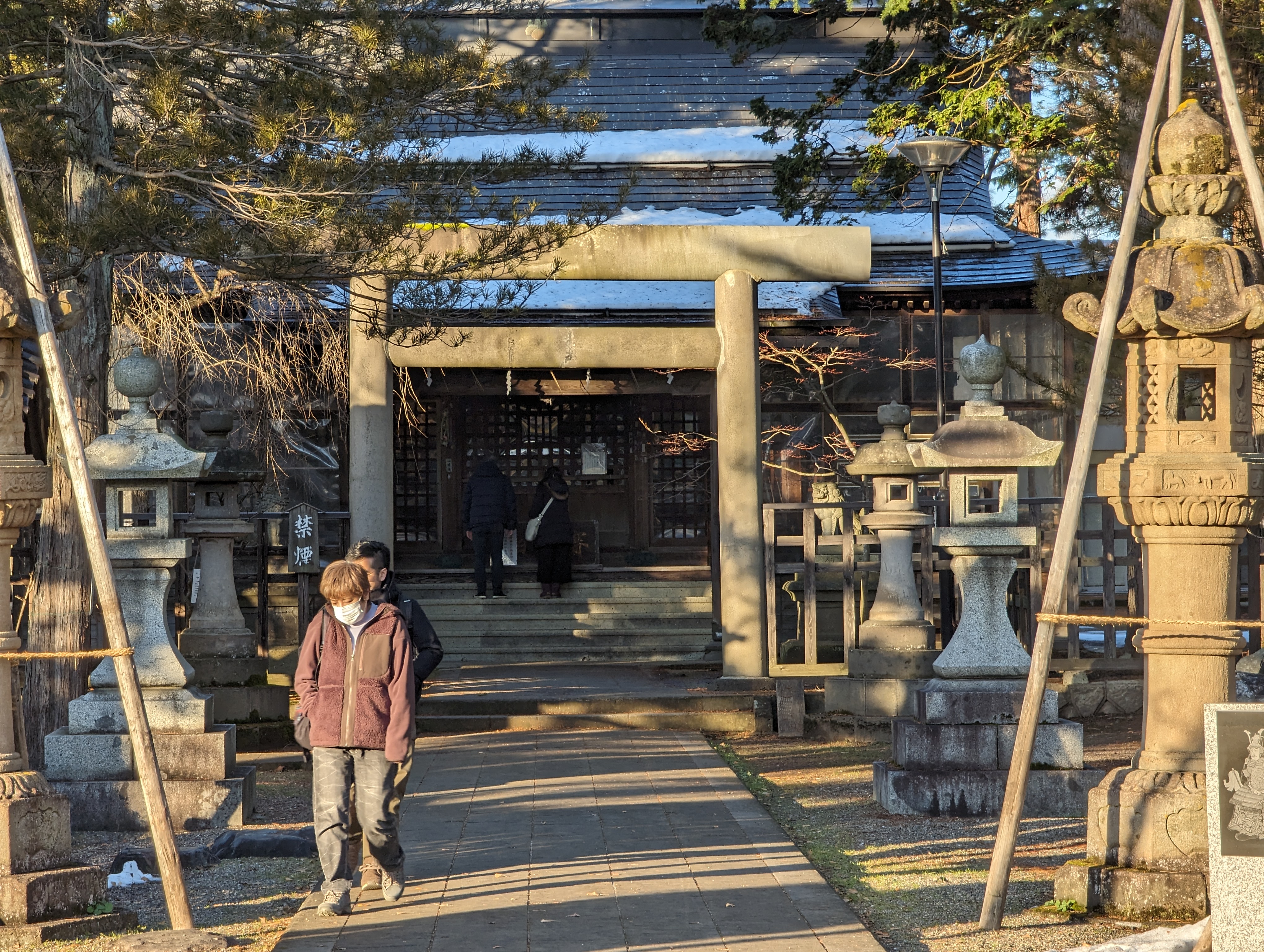 Uesugi Shrine at Yonezawa Castle with traditional wooden torii gate and autumn foliage