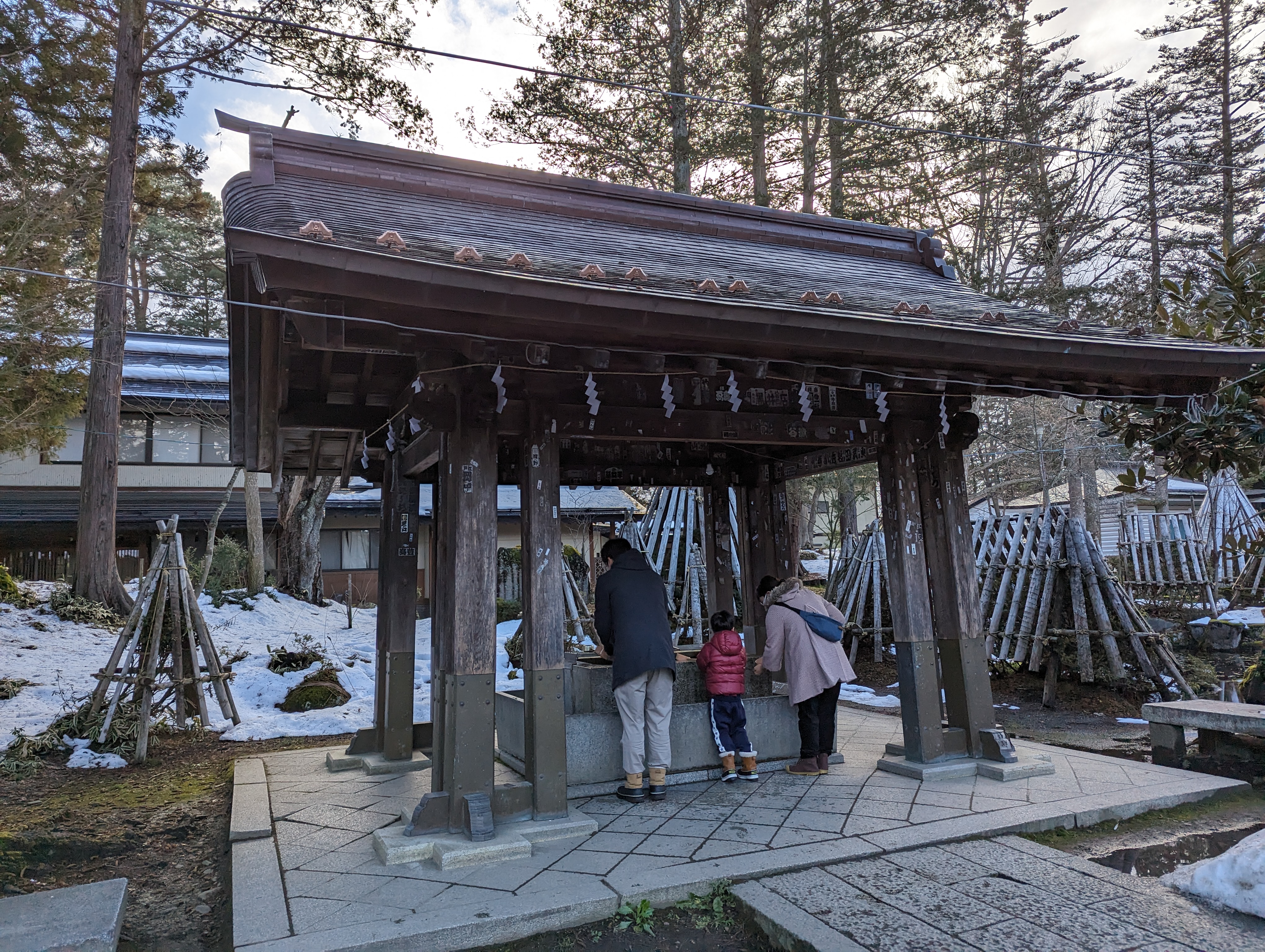 Yonezawa Castle grounds with cherry blossoms and Uesugi Shrine visible among the trees