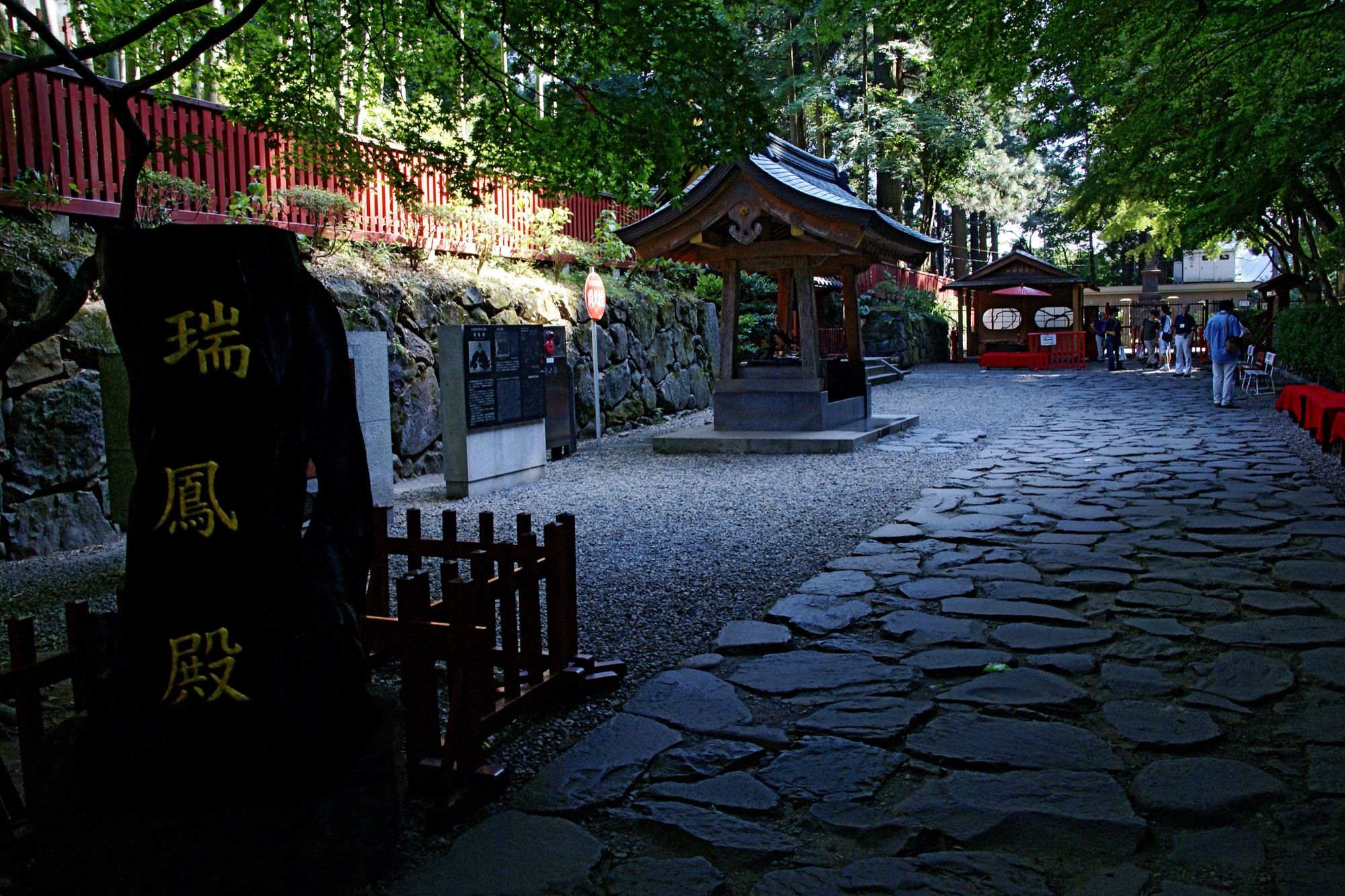 The ornate exterior of Zuihoden mausoleum surrounded by cedar forest in Sendai