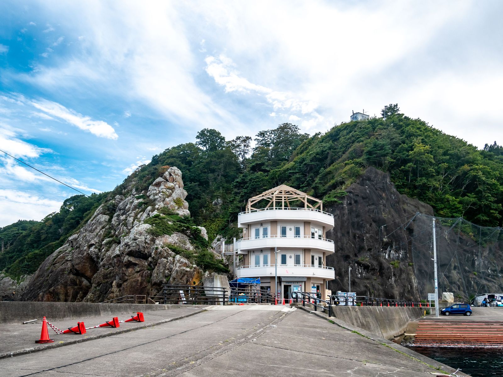 Kosode Ama Center building overlooking the coast in Kuji, Iwate