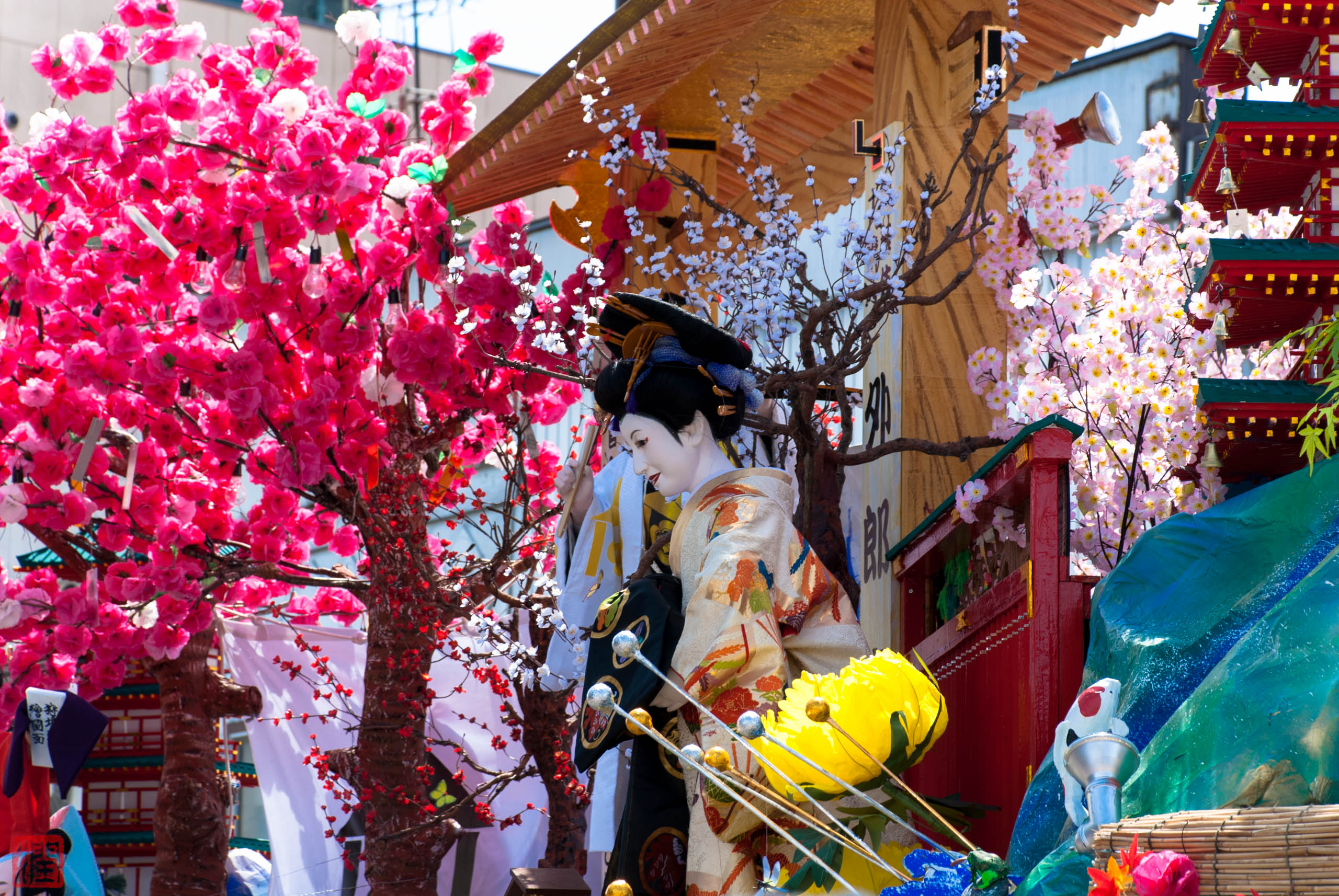 Illuminated festival float parading through the streets of Shinjo, Yamagata at night