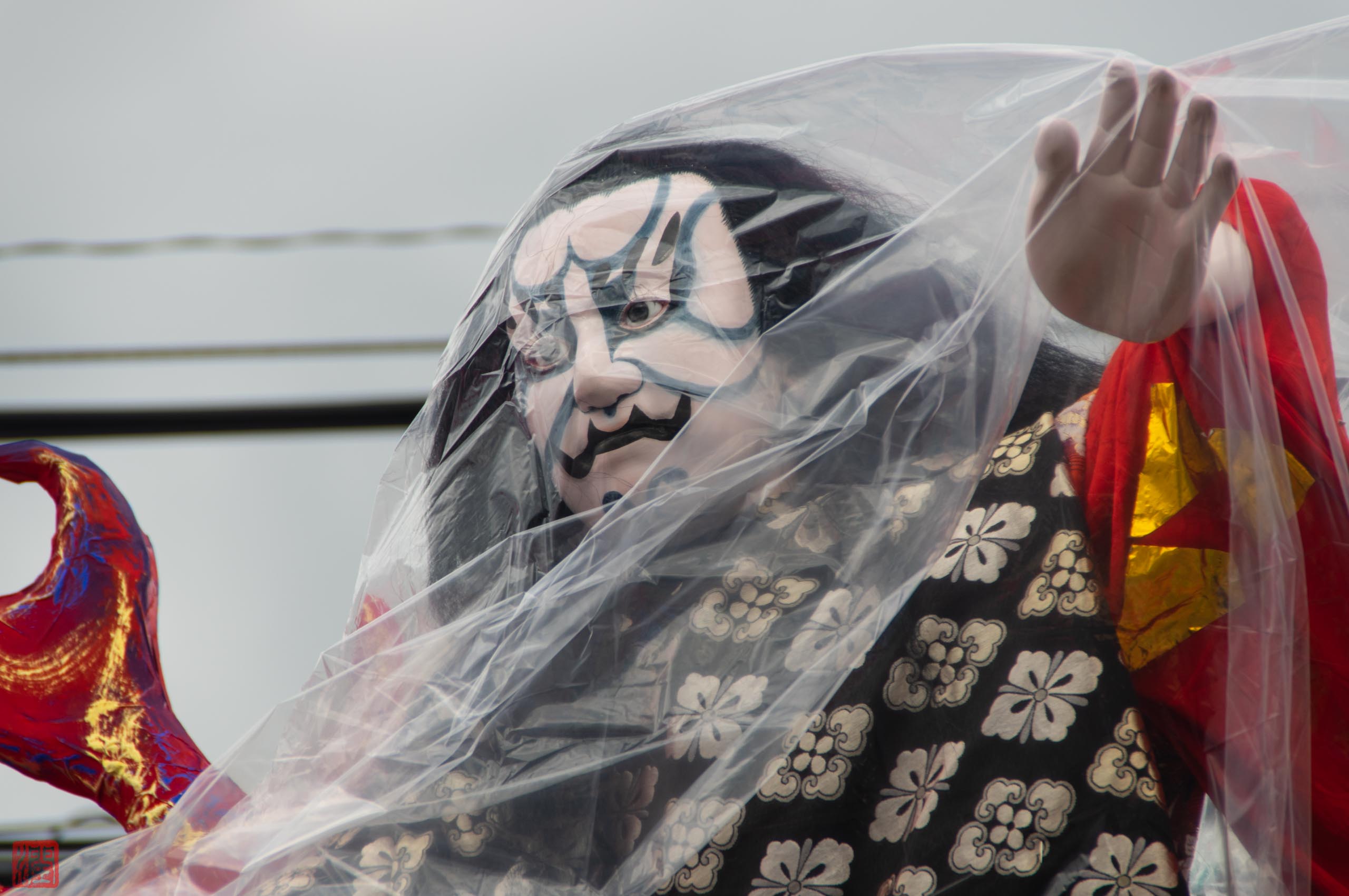 Close-up detail of a Shinjo Matsuri float showing hand-carved and painted craftsmanship