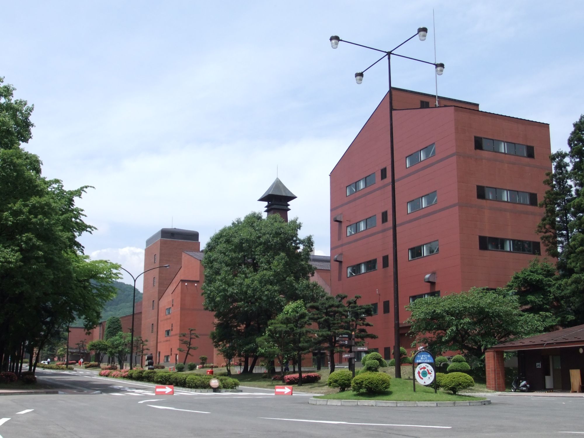 Miyagikyo Distillery buildings surrounded by forested mountains near Sendai, Japan